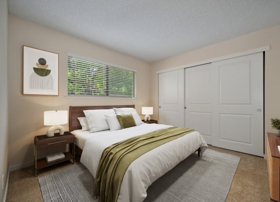 a bedroom with a large bed and a window at Silverstone Apartments, California