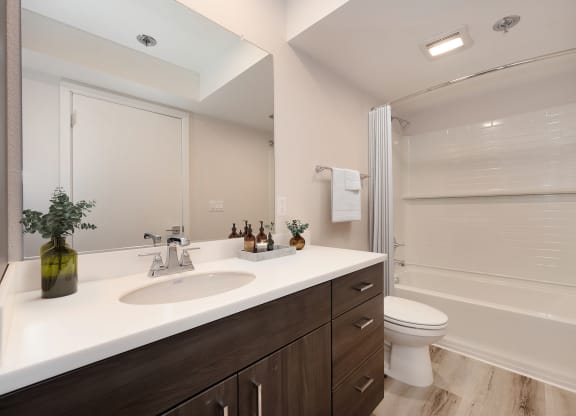 Track 281 2 bed, 2 bath home bathroom with sink, toilet and shower/tub enclosure. at Track 281 Apartments, Sacramento, CA