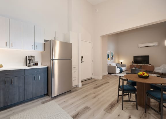 a kitchen and living room with stainless steel appliances and a wooden floor  at Track 281 Apartments, Sacramento, CA, 95811