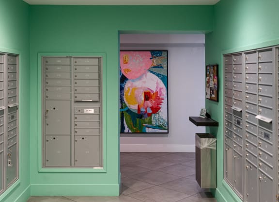 a locker room with lockers and a painting on the wall