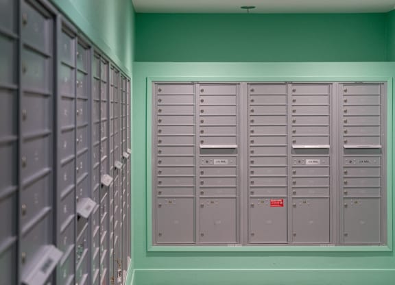 a row of lockers in a room with green walls