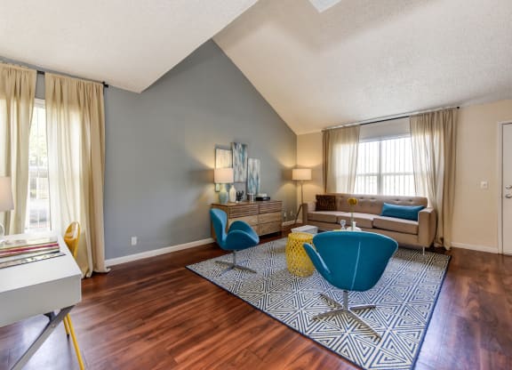 living room with hardwood inspired flooring and vaulted ceilings at Vineyard Terrace Apartments, Napa, CA
