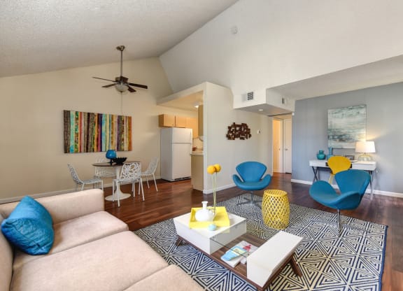 Model home living room and dining room with vaulted ceilings at Vineyard Terrace Apartments, California
