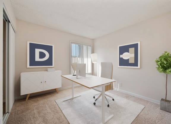 A spare bedroom used as an office  with a desk and a window at Vineyard Terrace Apartments, Napa, CA