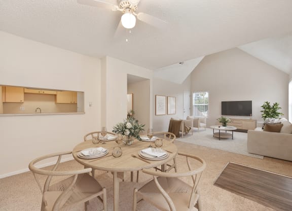 a dining room with a table and chairs at Vineyard Terrace Apartments, California, 94558
