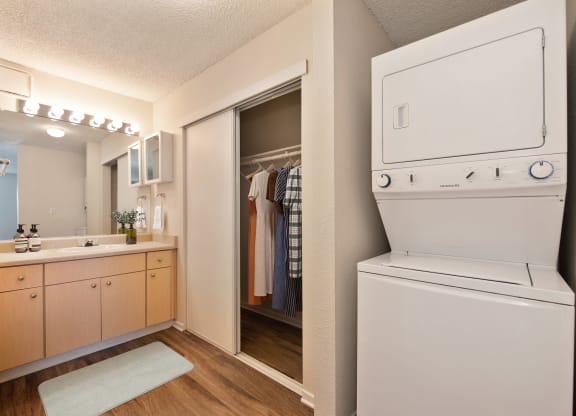 the preserve at ballantyne commons apartment laundry room with washer and dryer at Vineyard Terrace Apartments, California