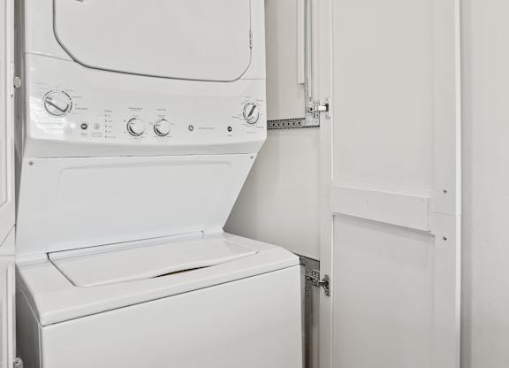 a small laundry room with a washer and dryer