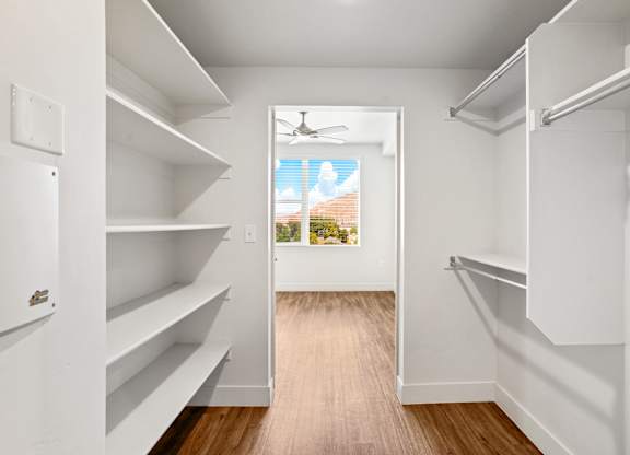 a walk in closet in a 555 waverly unit