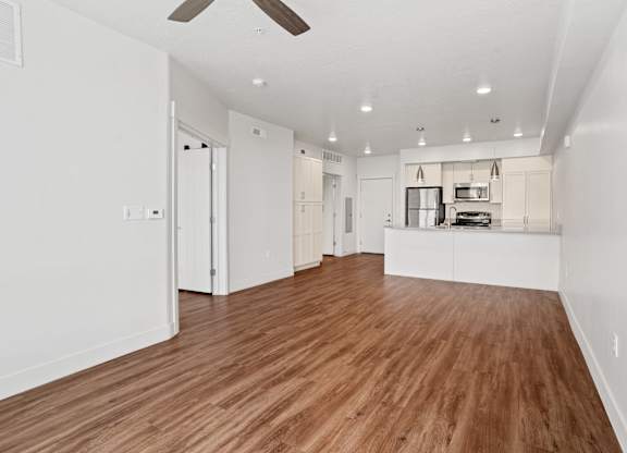 A room with wooden floors and white walls.