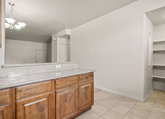 a kitchen with wooden cabinets and a counter top