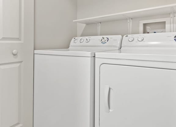 the washer and dryer in the laundry room of a home