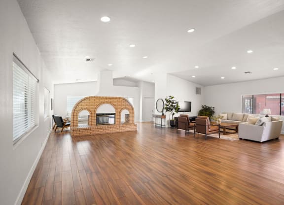 a living room with a fireplace and a wooden floor