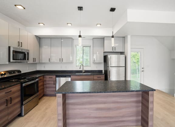 a kitchen with a counter top and a refrigerator