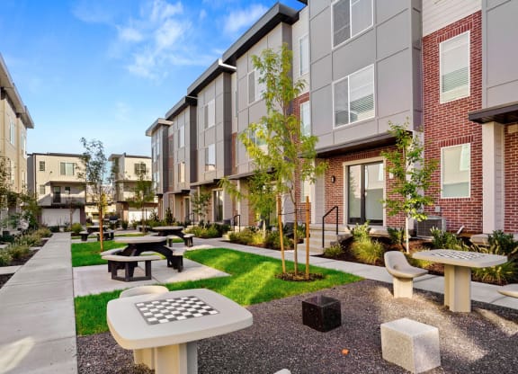 An outdoor Courtyard With Ample Sitting at Greens by Lotus Townhomes, Ogden, Utah
