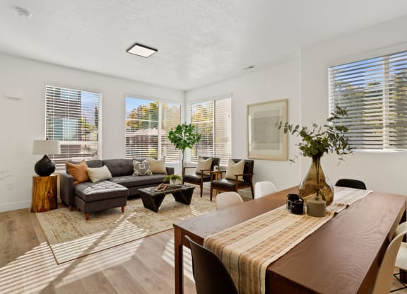 a living room and dining room at Greens by Lotus Townhomes, Ogden, UT