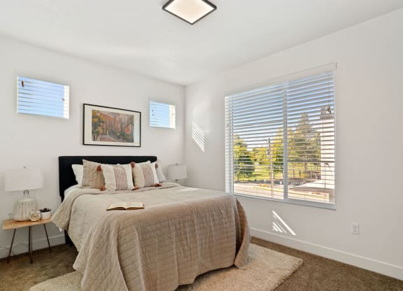 Decorated Bedroom with natural lights at Greens by Lotus Townhomes, Ogden, Utah