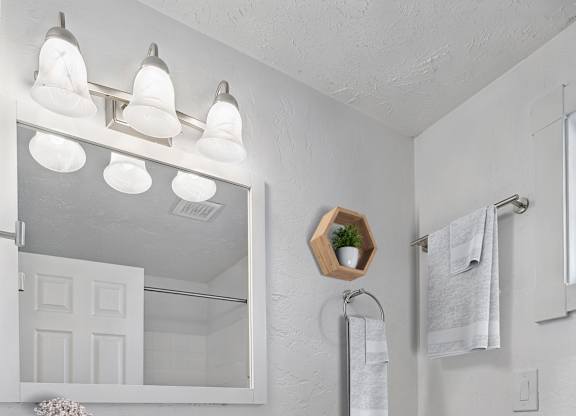 A white toilet sits next to a sink in a bathroom.