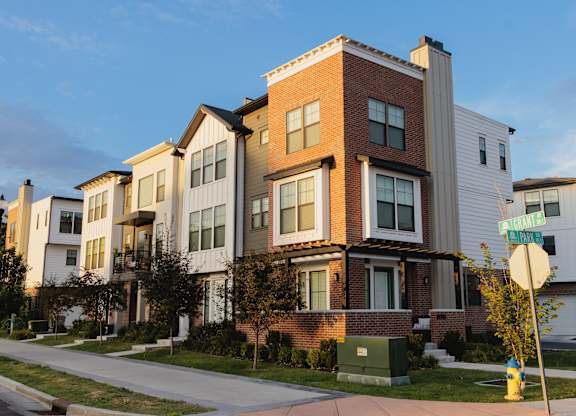 A multi-story apartment building with a sign that says "University Place.".