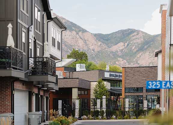 A street view with a building that has a sign that says 325 East.