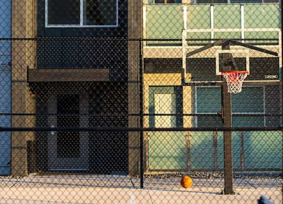 A basketball court is set up in front of a building.