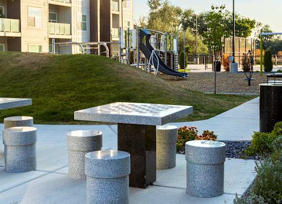 A modern building with a playground in front.