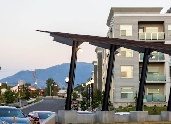 A modern building with a mountain in the background.