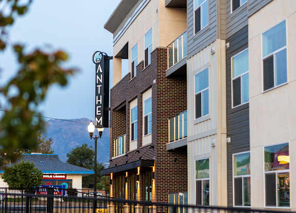 A building with a sign that says "Anthem" in front of it.
