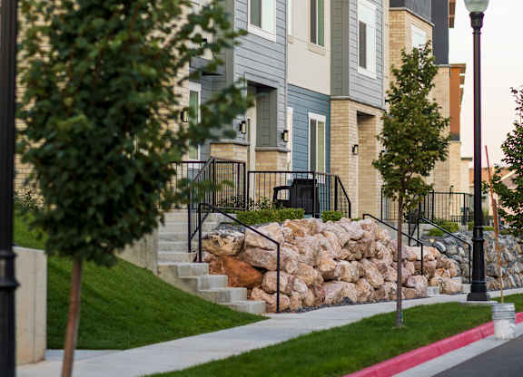 A street view of a residential area with apartment buildings.