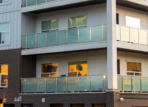 A modern building with a lotus flower logo on the top.