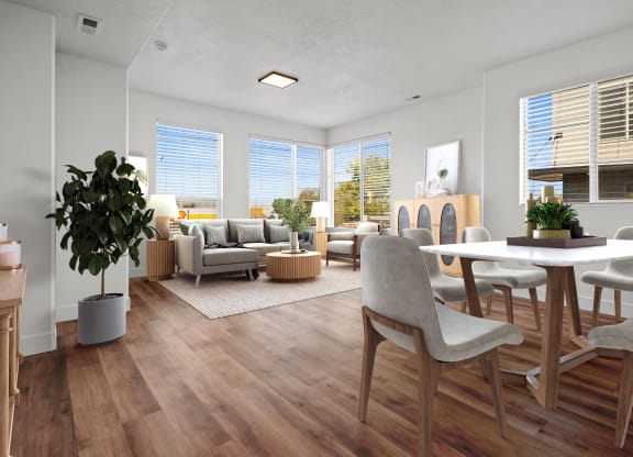 a living room and dining room with a table and chairs