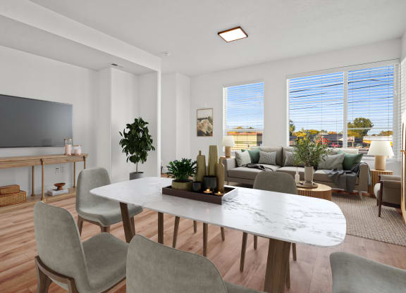 an open living room and dining room with a table and chairs