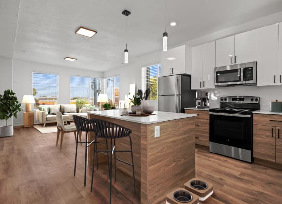 an open kitchen and living room with a table and chairs