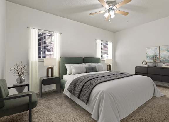 a bedroom with a bed and a ceiling fan