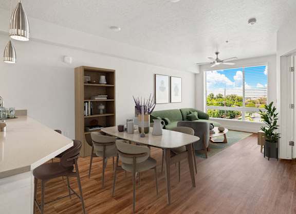 an open living room and dining room with a table and chairs