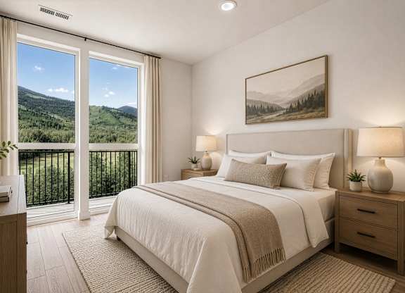A bedroom with a large bed, a balcony with a view of the mountains, and a painting on the wall.