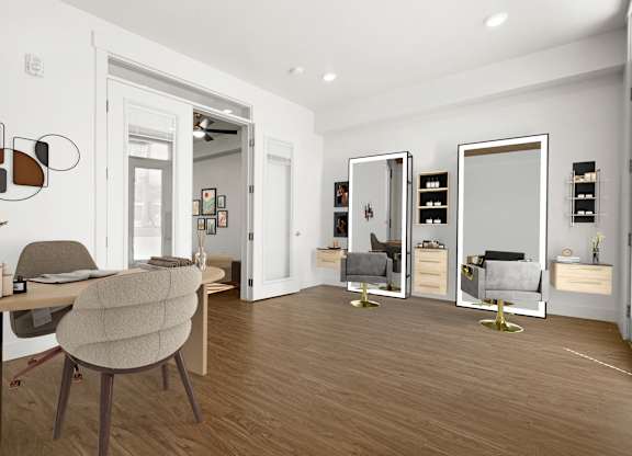 a living room with a desk and a mirror