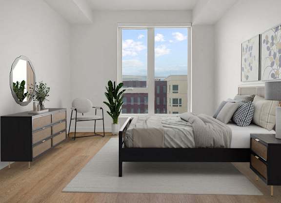 a living room with a bed and a window at SPARK Apartments, Salt Lake CIty, UT, 84116