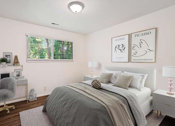 a bedroom with a large bed and two pictures on the wall