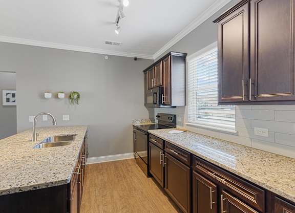 Large Kitchen With Granite Counters and Subway Tile BackSpash