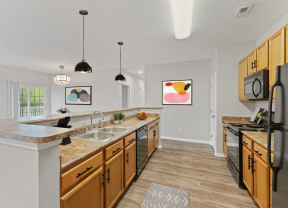Kitchen with pendant lighting at Aspen Lakes Apartments, Indiana, 46217