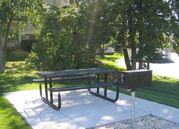 Outdoor picnic area at Sand Creek Woods Apartments, Indiana