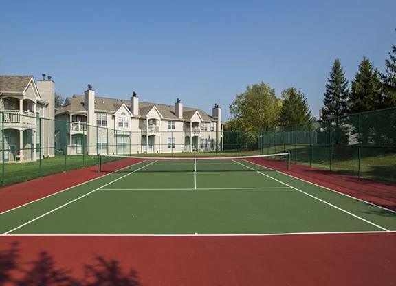 Community tennis court at Sand Creek Woods Apartments, Fishers