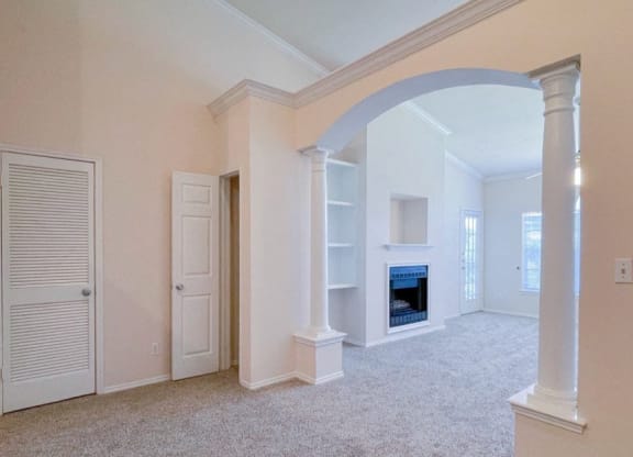 Spacious living rooms and dining rooms with coat closets at Turnberry Isle Apartments in Dallas, TX.