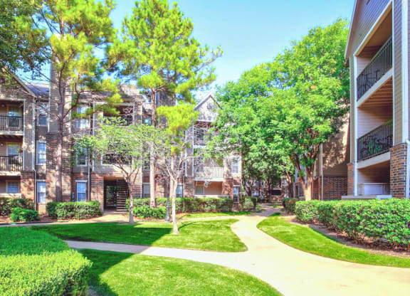 Mature trees and lush landscaping throughout the community at Riverside Park Apartments in Tulsa, OK!