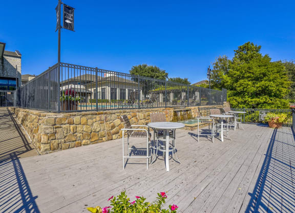 Lake doc with bistro tables for enjoyment at Cypress Lake at Stonebriar in Frisco, TX!