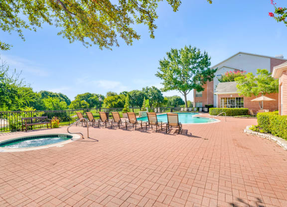 Sparkling pool and spa with golf course views. Turnberry Isle Apartments in Dallas, TX offers 1,2 and 3 Bedroom Apartment Homes.