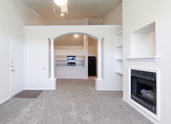 Spacious living rooms and archways at Turnberry Isle Apartments in Dallas, TX.