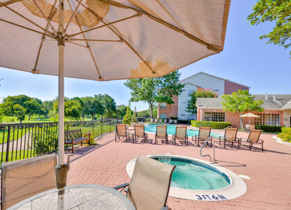 Enjoy a cool swim or warm up in our spa with golf course views at Turnberry Isle Apartments in Dallas, TX offers 1,2 and 3 Bedroom Apartment Homes.
