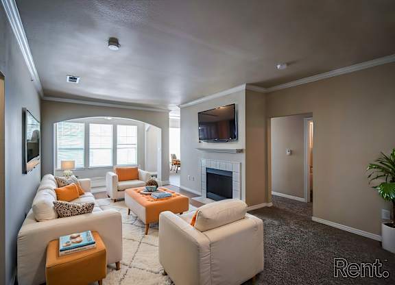 A living room with a fireplace and a couch.