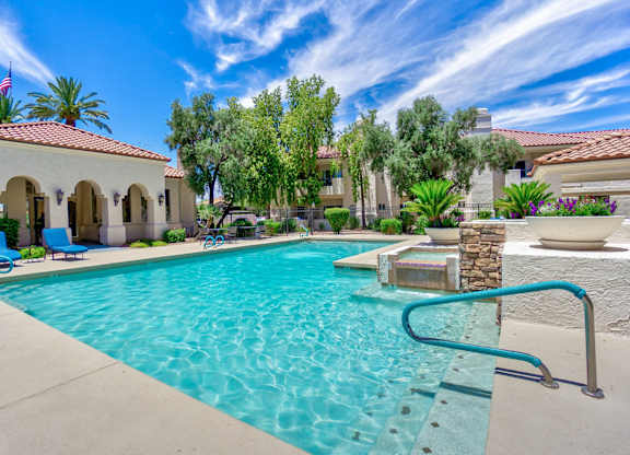 A pool with a ladder in the middle of it.